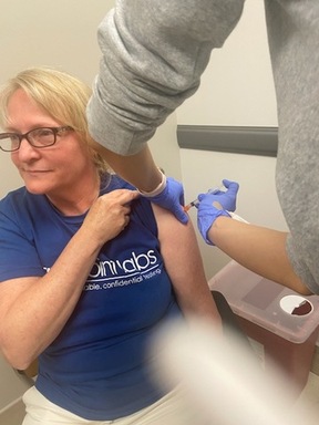 Katheen Buckland receiving vaccine.jpg